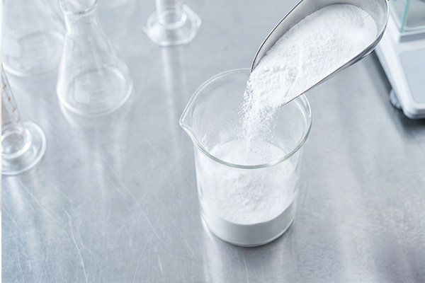 White nutraceutical powder being measured