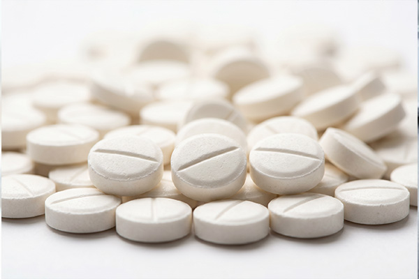 White pharmaceutical tablets close-up